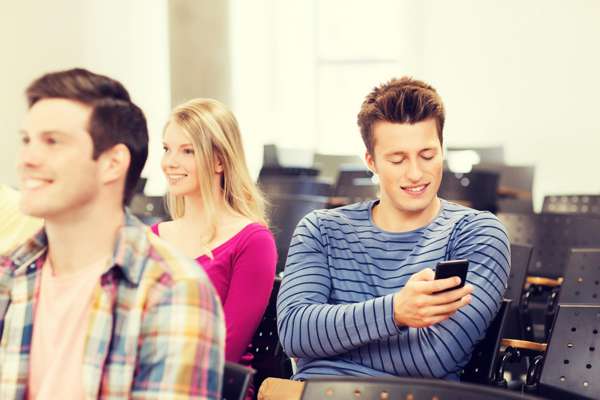 Student on smartphone in class