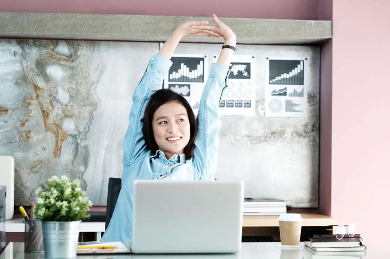 Stretching while working on laptop