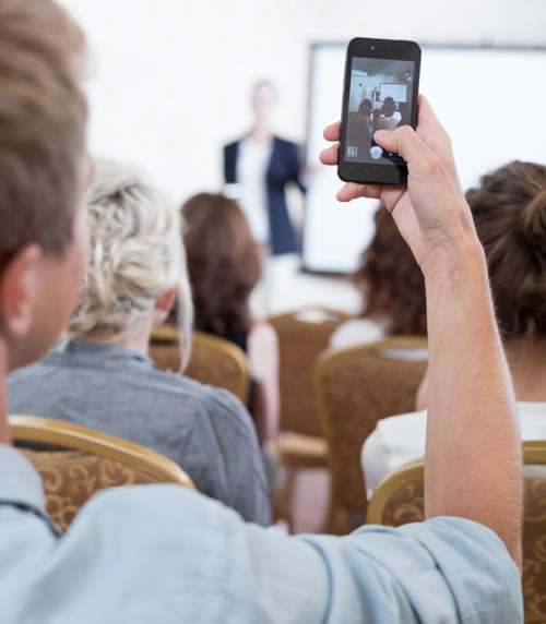 Student with smartphone in class